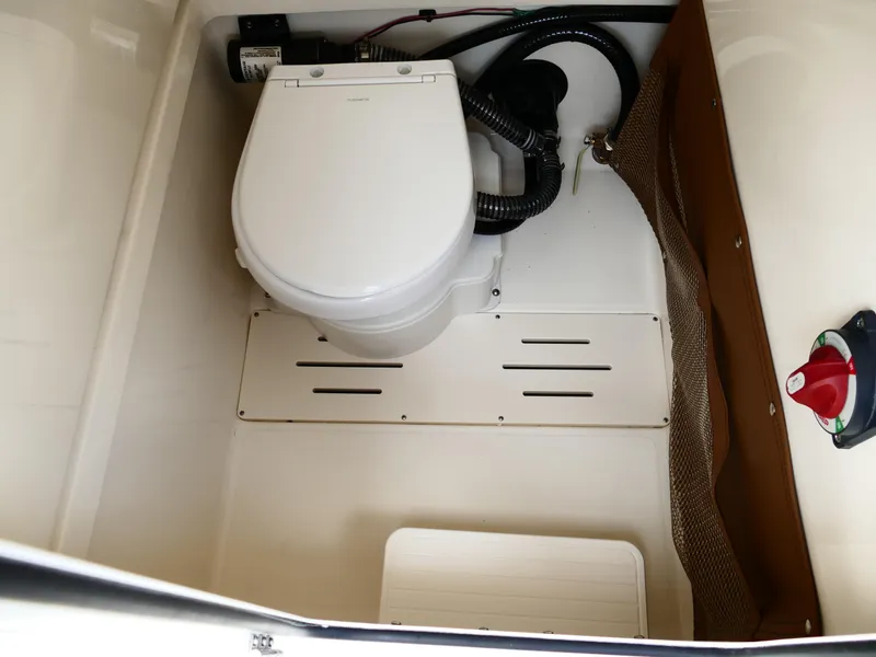 Slide: The Image of Compact marine toilet in 2026 Pioneer 222 Islander boat interior. - 35