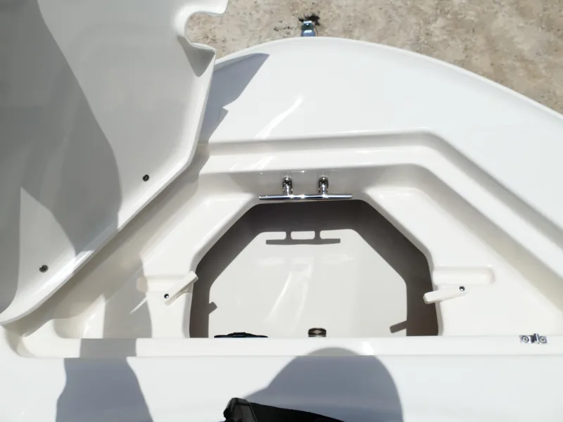 Slide: The Image of Open storage compartment of 2026 Pioneer 222 Islander boat, showcasing interior design. - 43