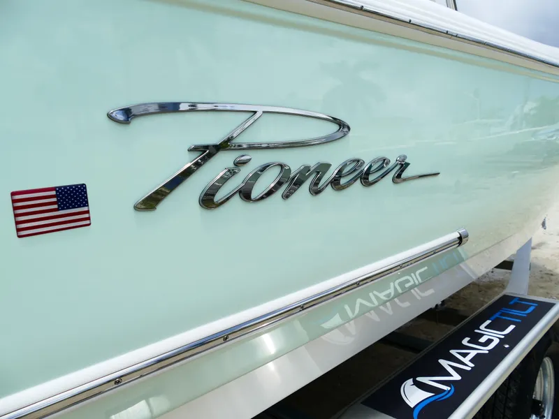 Slide: The Image of 2026 Pioneer 222 Islander boat with American flag decal on side. - 5