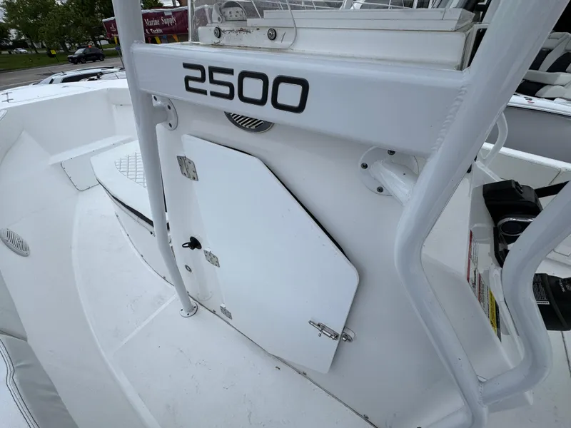 Slide: The Image of 2024 Clearwater 2500 boat interior with storage compartment and sleek design. - 13