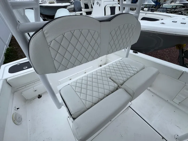 Slide: The Image of 2024 Clearwater 2500 boat with diamond-stitched white seating, showcasing luxury and comfort. - 14
