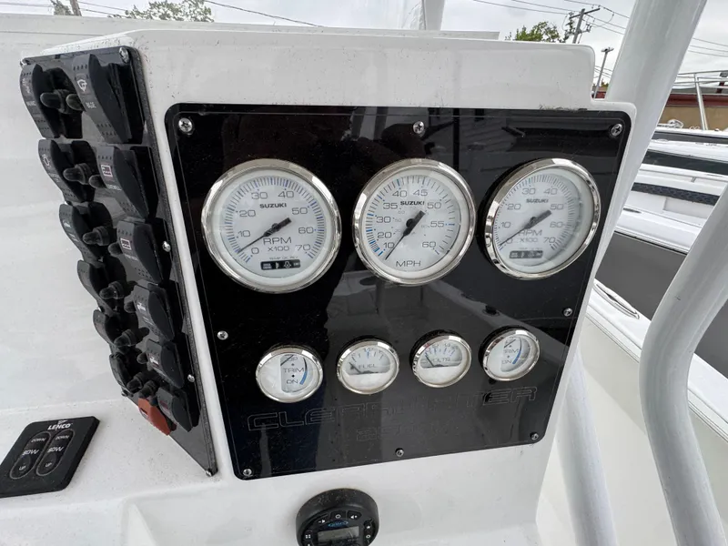 Slide: The Image of Dashboard of 2024 Clearwater 2500 boat with gauges and controls. - 15