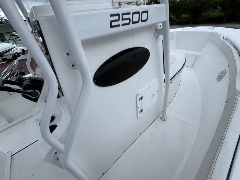 Slide: The Image of 2024 Clearwater 2500 boat interior, featuring sleek white design and modern controls. - 20