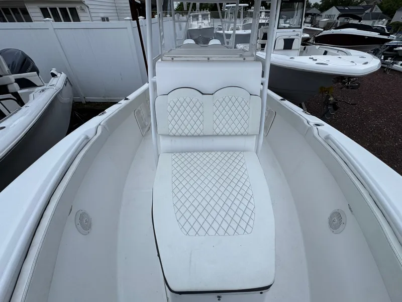 Slide: The Image of 2024 Clearwater 2500 boat interior with white cushioned seating and sleek design. - 3