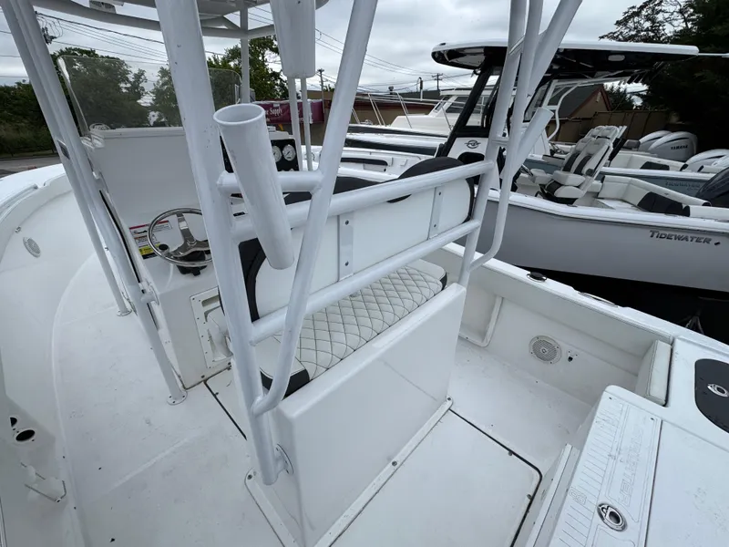 Slide: The Image of 2024 Clearwater 2500 boat interior with seating and steering console. - 8