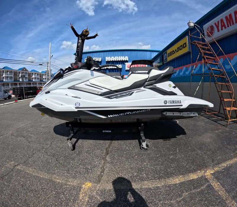 Slide: The Image of 2019 Yamaha WaveRunner FX Cruiser HO displayed at a marina with a person celebrating. - 4