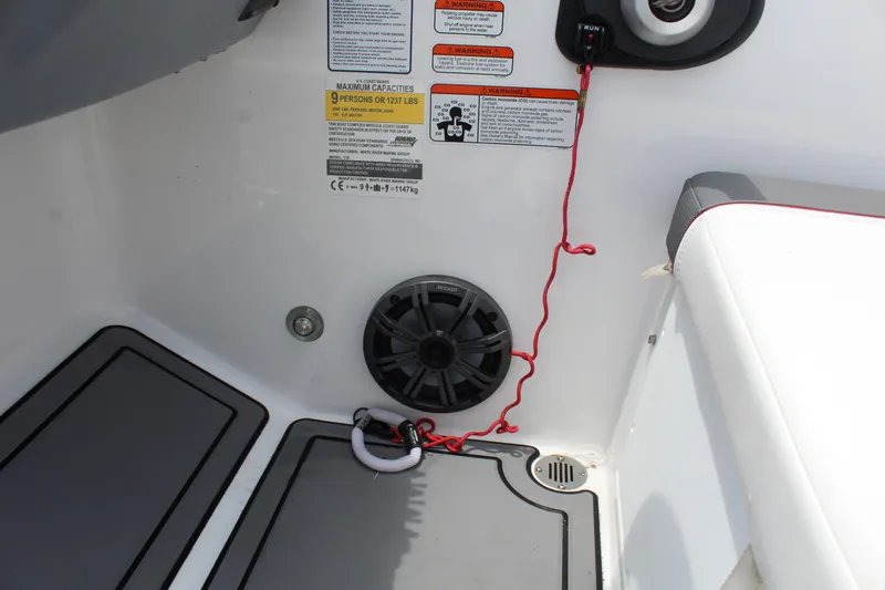 Slide: The Image of Interior of 2023 Tahoe T18 boat showing speaker and safety features. - 13
