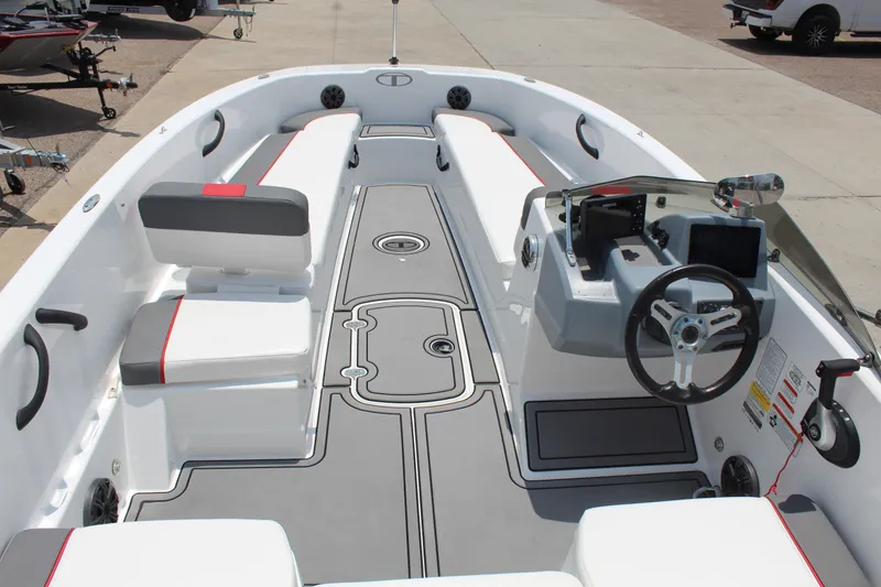 Slide: The Image of 2023 Tahoe T18 boat interior with modern seating and steering console. - 8