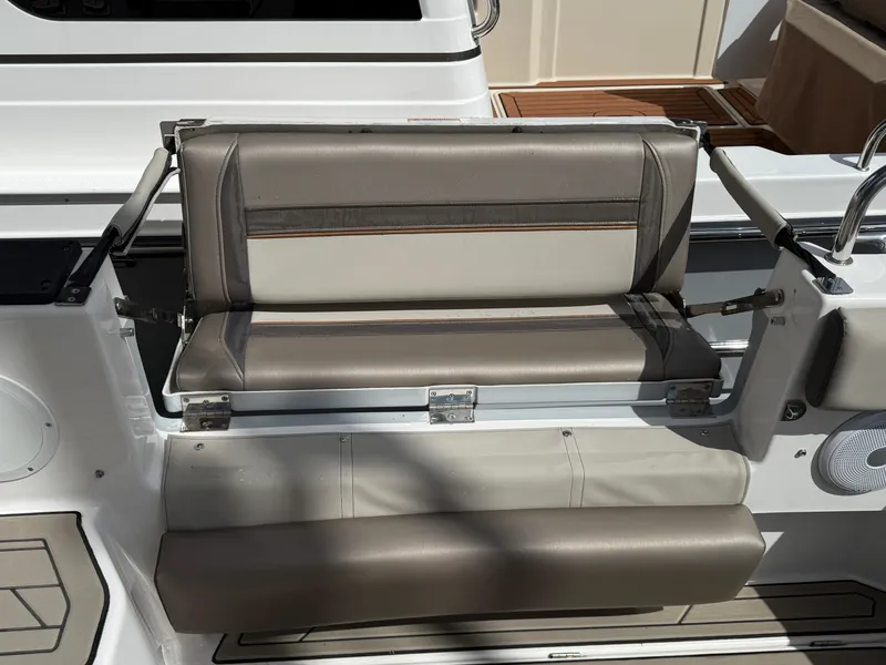 Slide: The Image of 2023 Cutwater C-32 CB boat seat with beige and gray upholstery. - 11