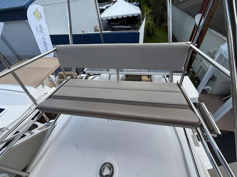Slide: The Image of 2023 Cutwater C-32 CB boat with cushioned seating on the deck. - 16