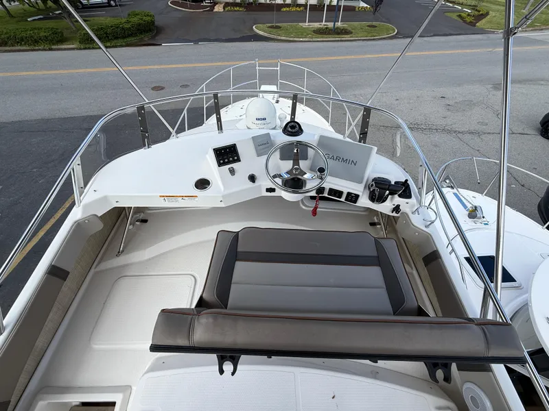 Slide: The Image of 2023 Cutwater C-32 CB boat helm with Garmin navigation system and seating. - 17