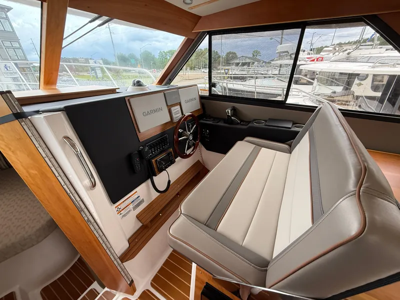 Slide: The Image of 2023 Cutwater C-32 CB helm with dual Garmin displays and leather seating. - 22