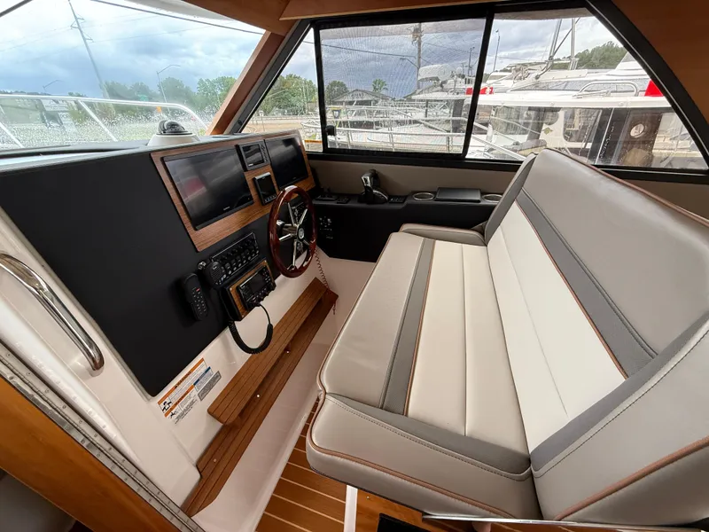 Slide: The Image of 2023 Cutwater C-32 CB boat interior with modern helm and seating. - 24