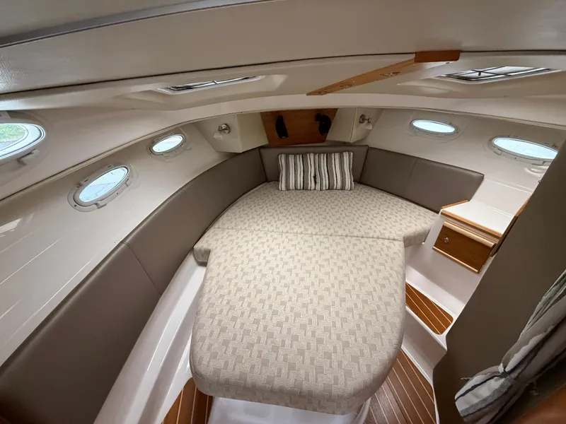 Slide: The Image of 2023 Cutwater C-32 CB cabin interior with cozy bed and elegant design. - 26