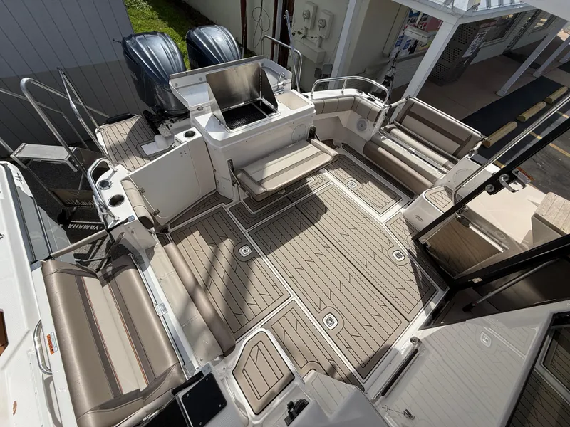 Slide: The Image of 2023 Cutwater C-32 CB boat deck with seating and dual engines. - 7