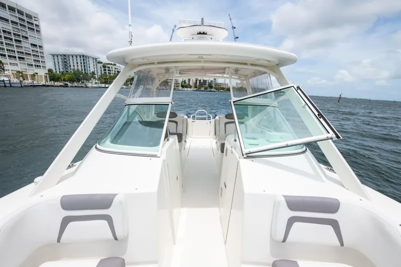 Slide: The Image of 2019 World Cat 296DC boat on water, featuring spacious seating and modern design. - 39