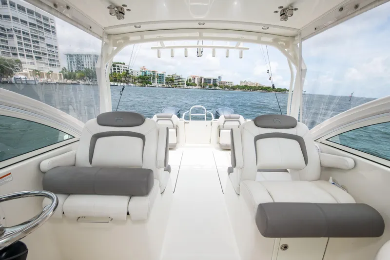 Slide: The Image of 2019 World Cat 296DC boat interior with luxurious seating and ocean view. - 40