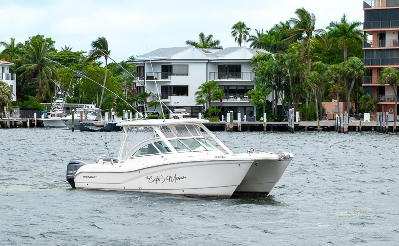 Slide: The Image of 2019 World Cat 296DC boat cruising near waterfront homes. - 47