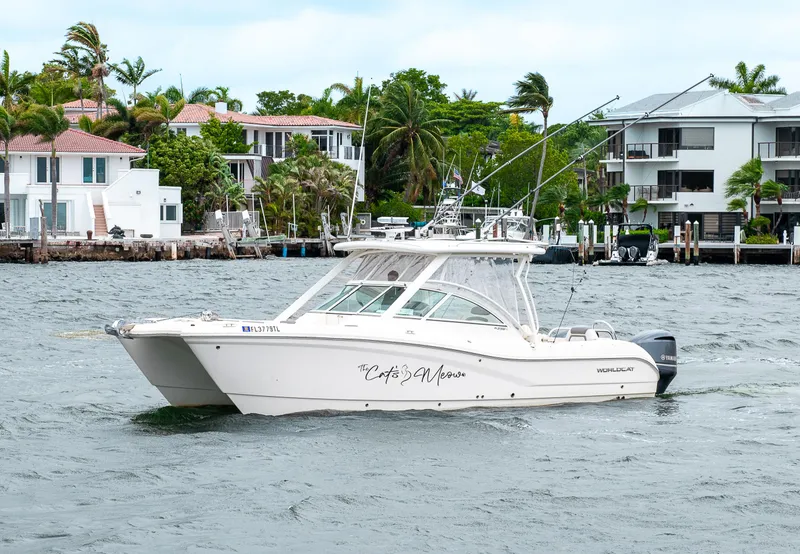 Slide: The Image of 2019 World Cat 296DC boat cruising near waterfront homes. - 49