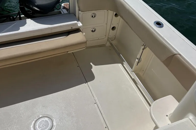 Slide: The Image of 2012 Scout 262 Abaco boat interior with seating and storage compartments. - 12