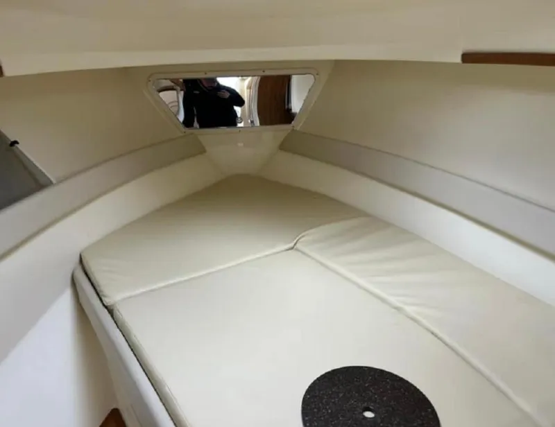 Slide: The Image of 2012 Scout 262 Abaco cabin interior with cushioned sleeping area. - 14