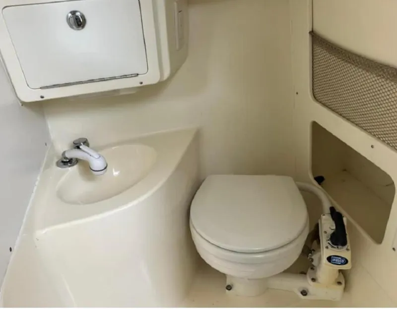 Slide: The Image of 2012 Scout 262 Abaco boat bathroom with sink and toilet. - 16