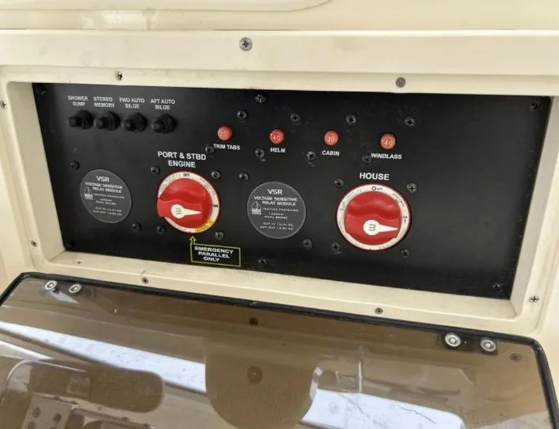 Slide: The Image of Control panel of a 2012 Scout 262 Abaco boat with engine and house switches. - 18