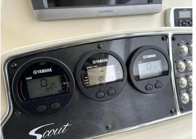 Slide: The Image of Control panel of 2012 Scout 262 Abaco boat with Yamaha gauges and Garmin display. - 19
