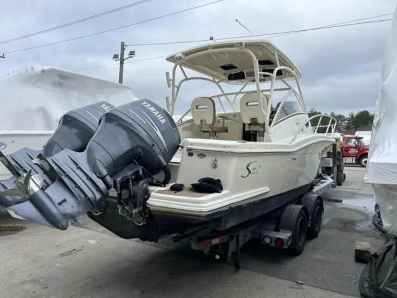 Slide: The Image of 2012 Scout 262 Abaco boat with twin Yamaha engines on a trailer. - 3