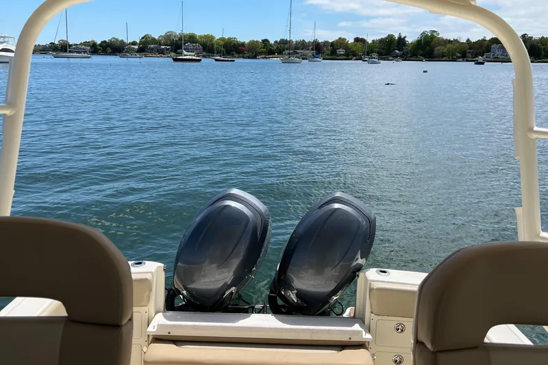 Slide: The Image of 2012 Scout 262 Abaco boat with dual engines on a calm lake. - 6