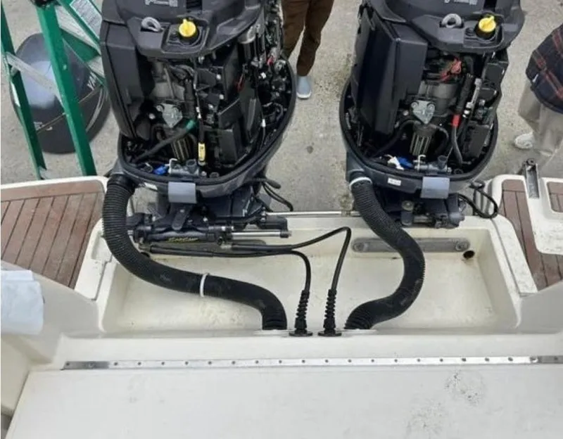 Slide: The Image of Twin outboard engines on a 2012 Scout 262 Abaco boat, viewed from above. - 7