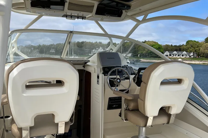 Slide: The Image of 2012 Scout 262 Abaco boat interior with dual helm seats and steering wheel. - 8