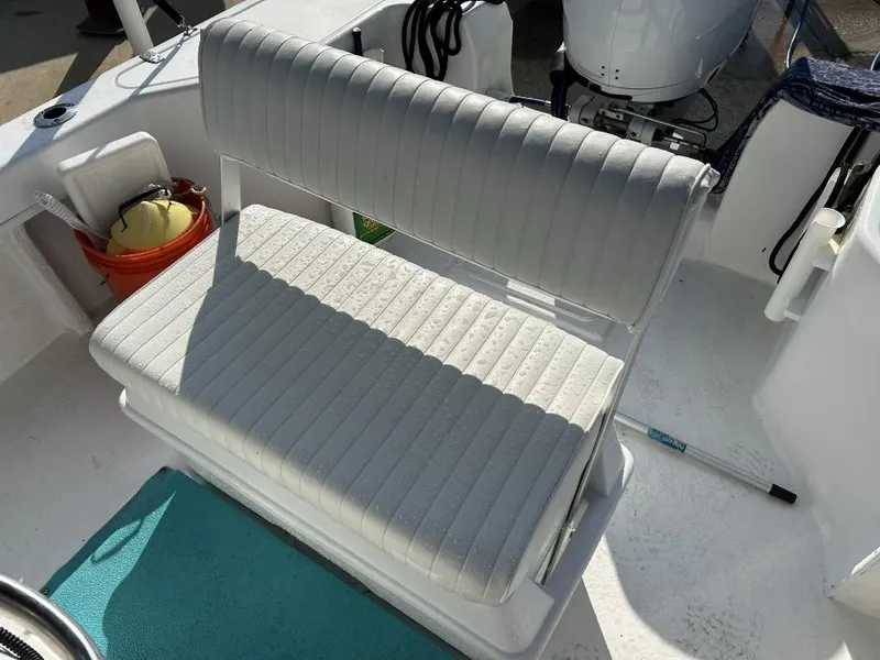 Slide: The Image of 2024 C-Hawk 19 Center Console boat interior with cushioned seating. - 14