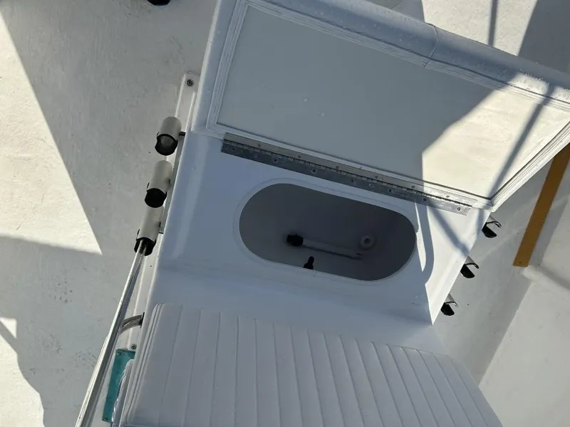 Slide: The Image of 2024 C-Hawk 19 Center Console boat interior with open storage compartment. - 5