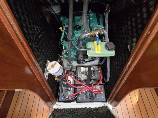 Slide: The Image of Engine compartment of 2002 Beneteau First 36.7 sailboat, featuring batteries and mechanical components. - 14