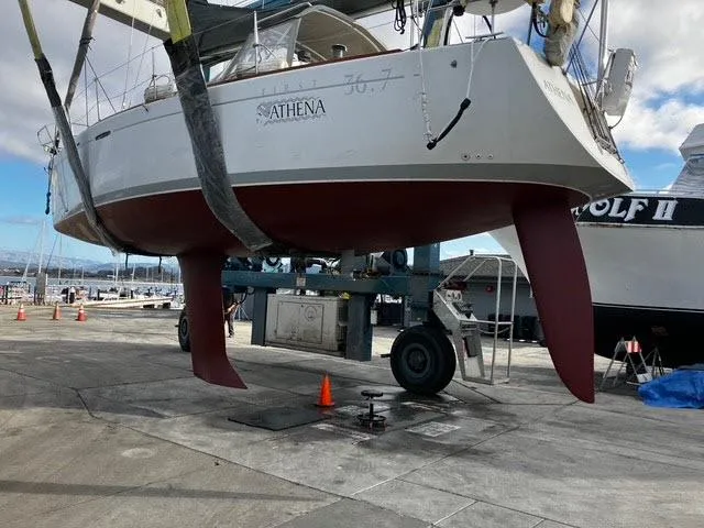 Slide: The Image of Beneteau First 36.7 sailboat from 2002 in dry dock, showing hull and keel. - 16