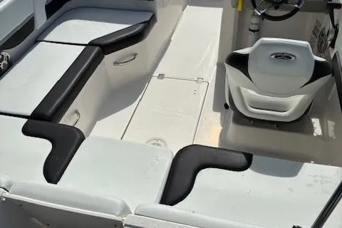 Slide: The Image of 2018 Chaparral 191 Suncoast boat interior with white and black seating. - 13