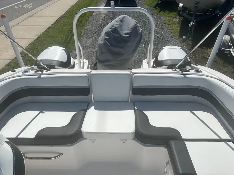 Slide: The Image of 2018 Chaparral 191 Suncoast boat interior with seating and covered engine. - 14