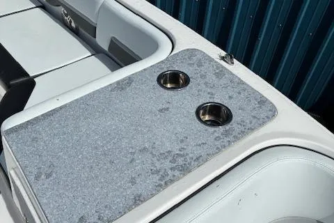 Slide: The Image of 2018 Chaparral 191 Suncoast boat interior with cup holders and seating. - 18