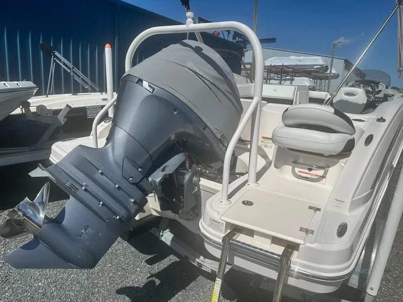 Slide: The Image of 2018 Chaparral 191 Suncoast boat with outboard motor and swim platform. - 23
