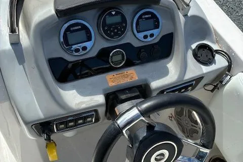 Slide: The Image of Steering console of 2018 Chaparral 191 Suncoast boat with gauges and controls. - 8