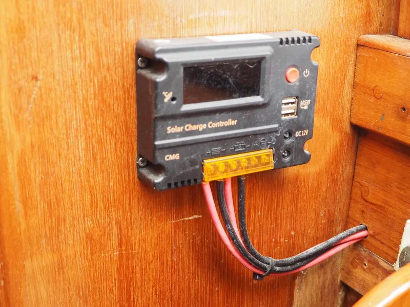 Slide: The Image of Solar charge controller on 1996 Com-Pac 27-2 boat, mounted on wooden panel. - 20