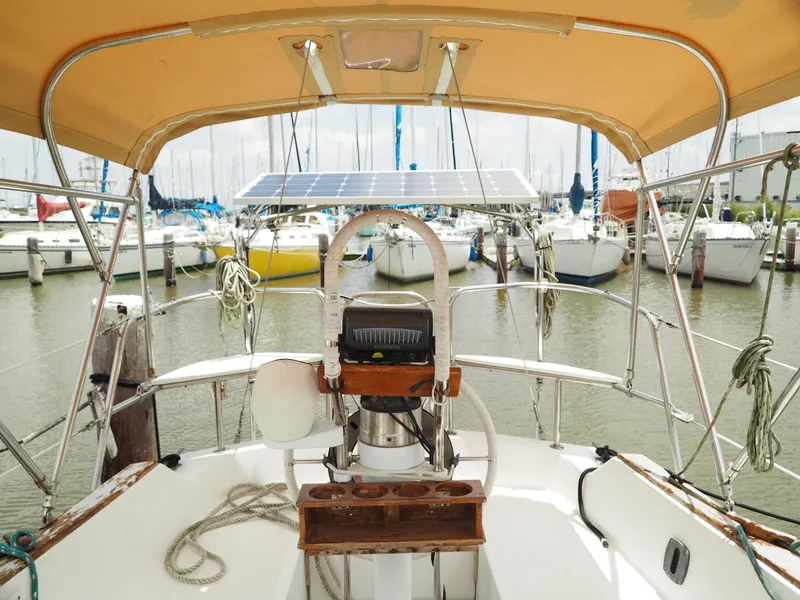 Slide: The Image of Cockpit view of 1996 Com-Pac 27-2 sailboat with solar panel in marina. - 9