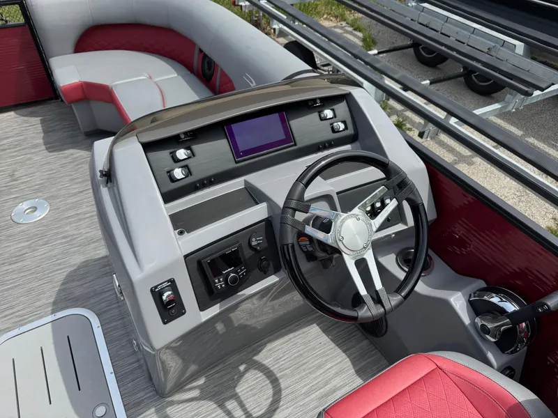 Slide: The Image of 2022 Bennington 22 LSR boat dashboard with steering wheel and control panel. - 3