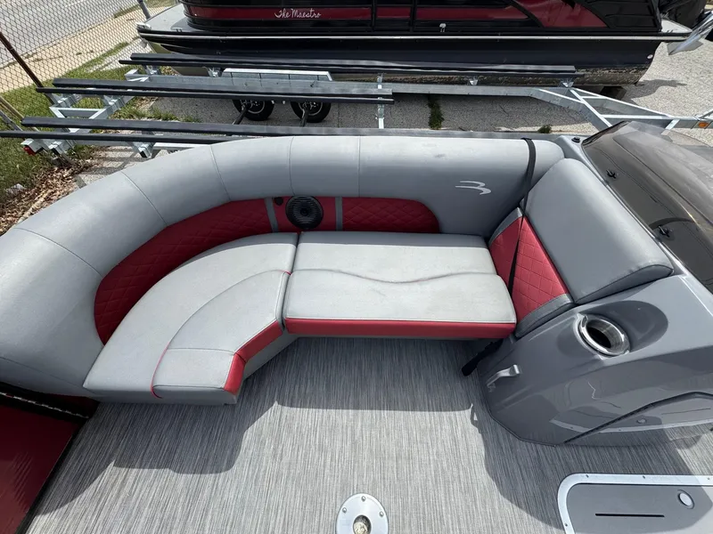 Slide: The Image of 2022 Bennington 22 LSR boat interior with gray and red seating. - 6
