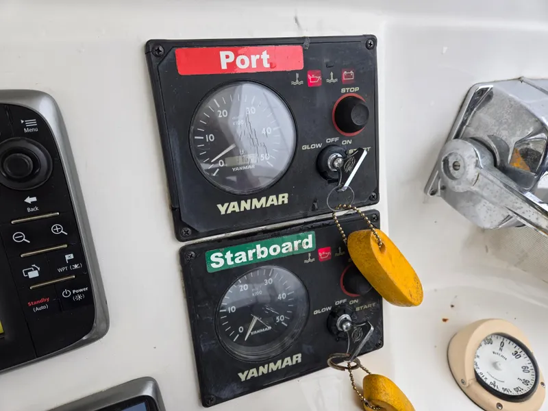 Slide: The Image of 2013 Gemini Legacy 35 engine controls at helm - 35