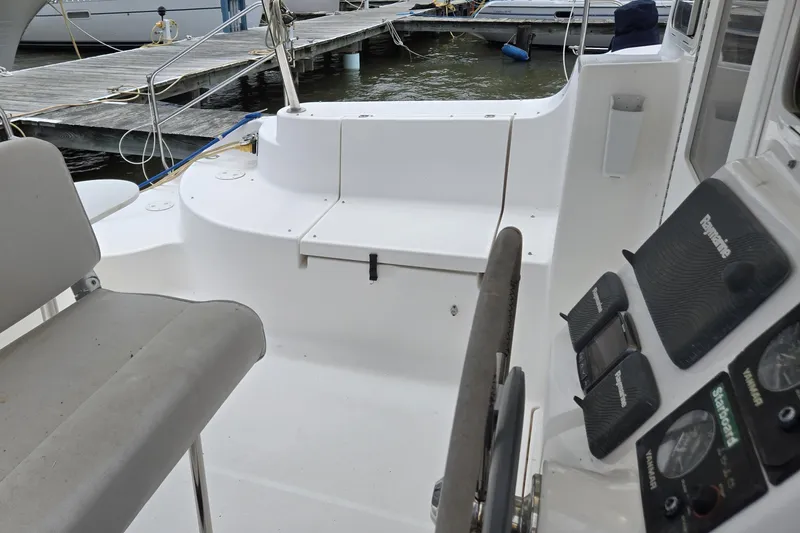 Slide: The Image of Cockpit of 2013 Gemini Legacy 35 sailboat with steering wheel and navigation instruments. - 6