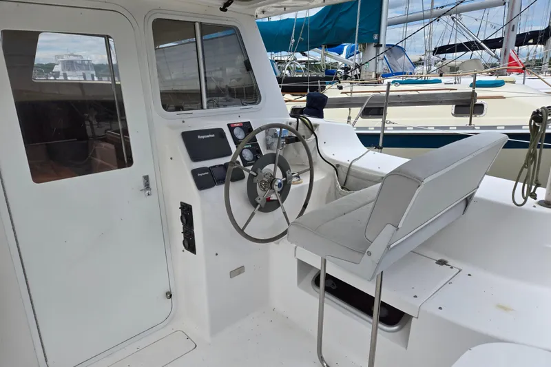 Slide: The Image of Cockpit of 2013 Gemini Legacy 35 sailboat with steering wheel and seating. - 8