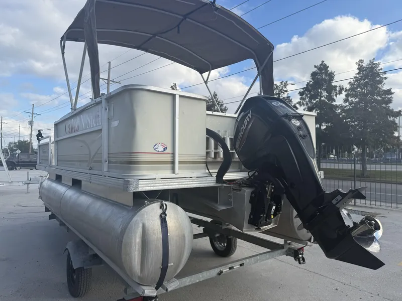 Slide: The Image of 2003 Crest 18 Fisherman pontoon boat with Mercury outboard motor on trailer. - 5