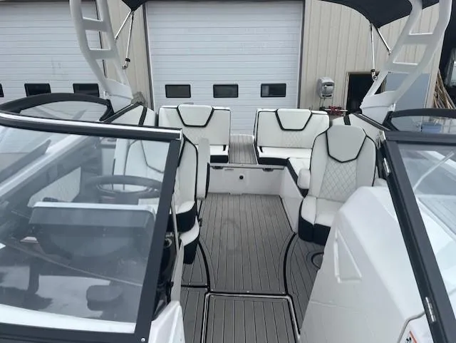 Slide: The Image of 2024 Yamaha Boats 252 S interior with sleek seating and modern design. - 11